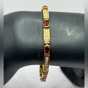 JJT gold over 925 sterling silver tennis bracelet with red stones